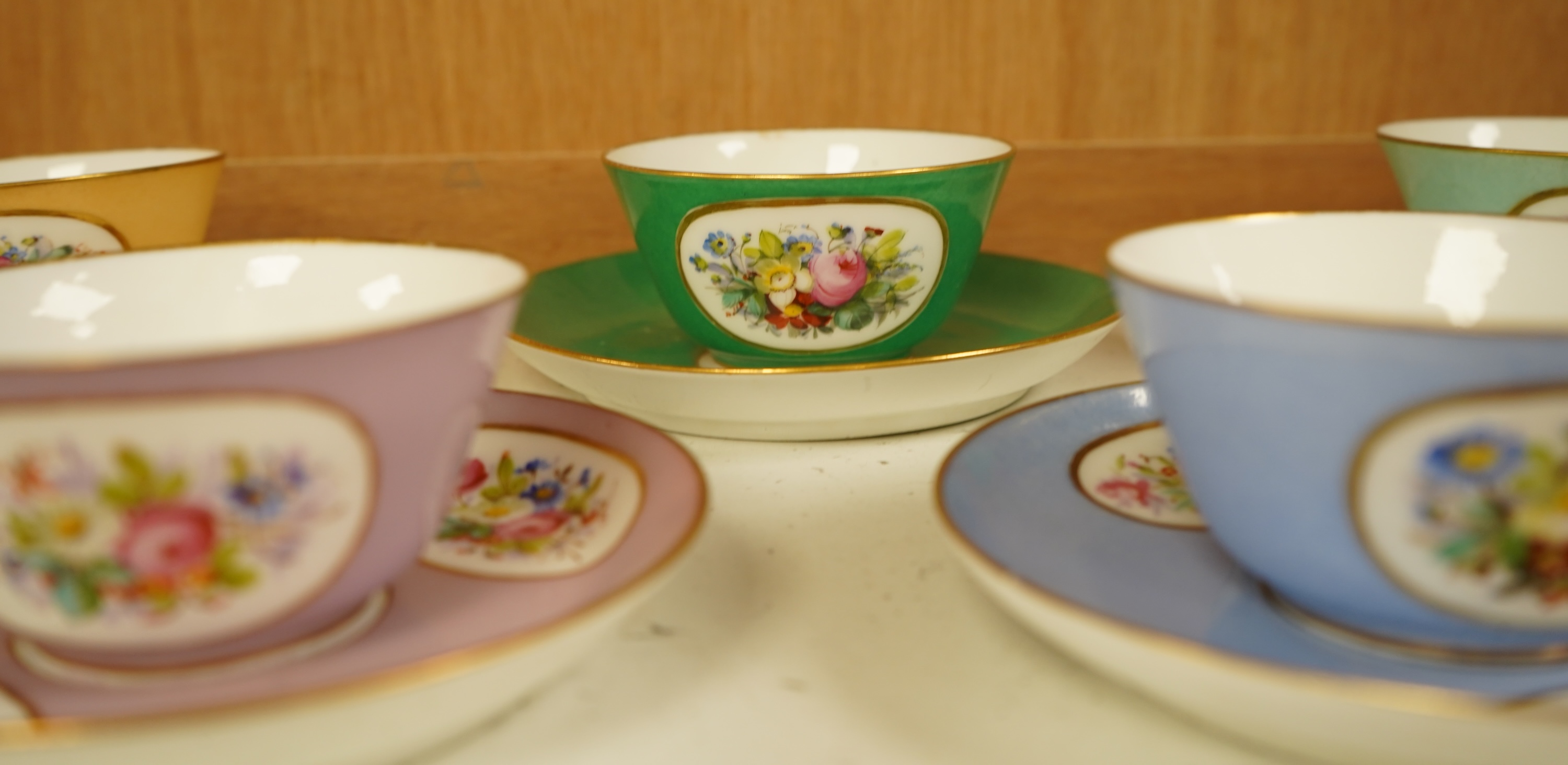 A Sevres style harlequin tea service for six, each saucer 13cm in diameter